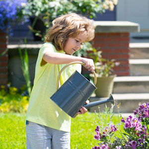 Child watering plants